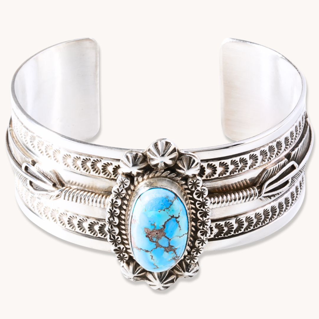 Hand-Stamped Golden Hills Turquoise Cuff Bracelet made of sterling silver featuring a central turquoise stone.