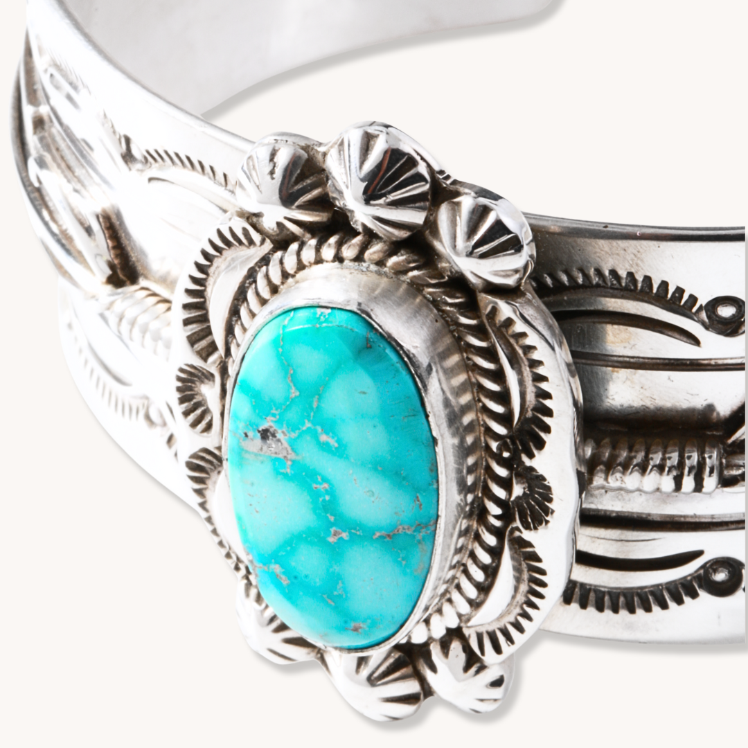 Hand-Stamped Turquoise Cuff Bracelet by T.Skies, crafted from sterling silver with a vibrant turquoise stone centerpiece.