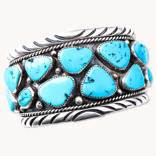 Turquoise Navajo Cluster Cuff Bracelet made of sterling silver, featuring multiple turquoise stones in a cluster design.