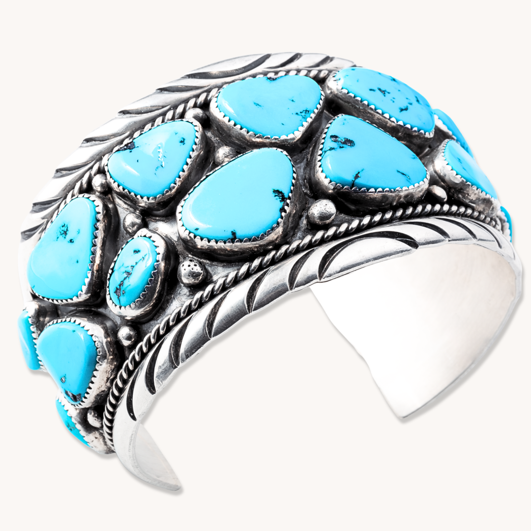 Turquoise Navajo Cluster Cuff Bracelet made of sterling silver, featuring multiple turquoise stones in a cluster design.