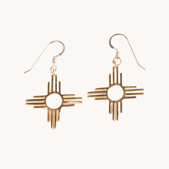 Enchantment: Zia Dangle Jewelry Set, sterling silver earrings featuring a Zia sun symbol design.