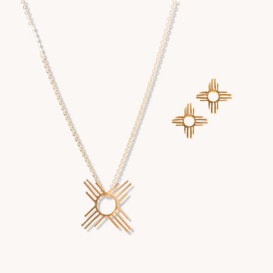 Enchantment: Petite Pendant & Zia Studs in sterling silver, featuring a sun symbol design, elegant and modern.