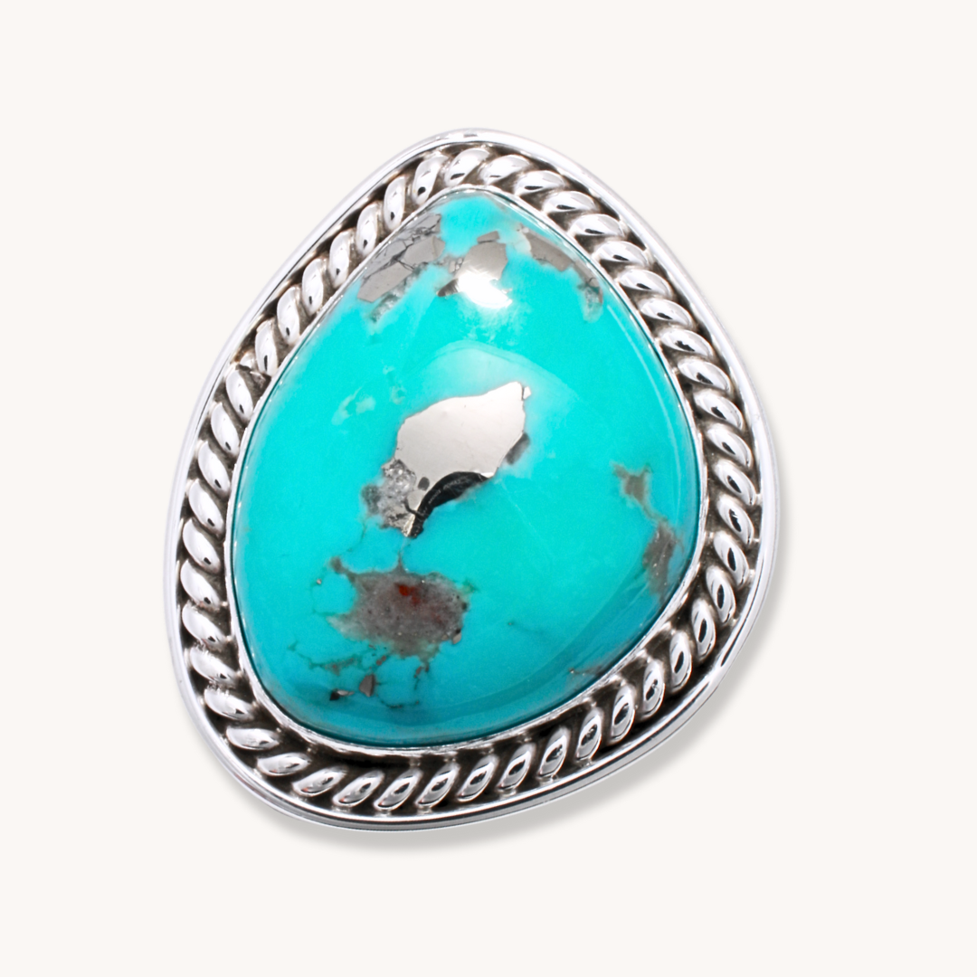 Classic Turquoise Ring with Twist Wire Border, crafted from sterling silver, showcasing vibrant turquoise stone.