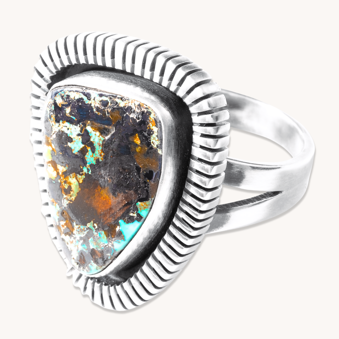 T.Skies Turquoise Ring featuring a triangular stone with a file-work border, crafted in sterling silver.