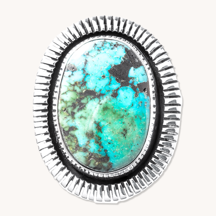 T.Skies Turquoise Ring featuring a vibrant turquoise stone with a detailed file-work border in sterling silver.