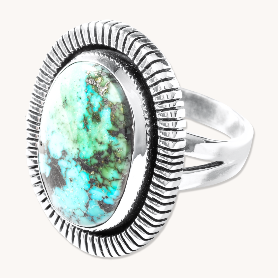 T.Skies Turquoise Ring featuring a large turquoise stone with a file-work border in sterling silver.