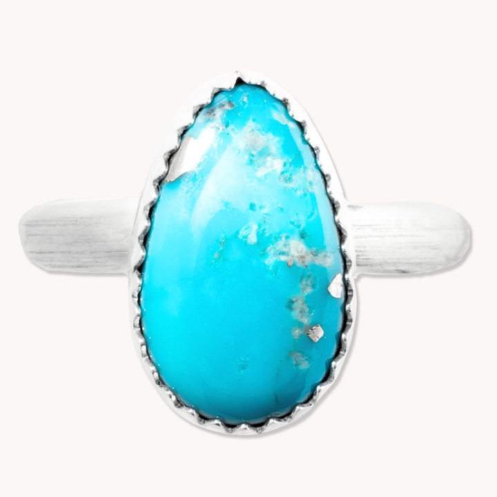 Simple Turquoise Ring by T.Skies, featuring a teardrop turquoise stone set in sterling silver.