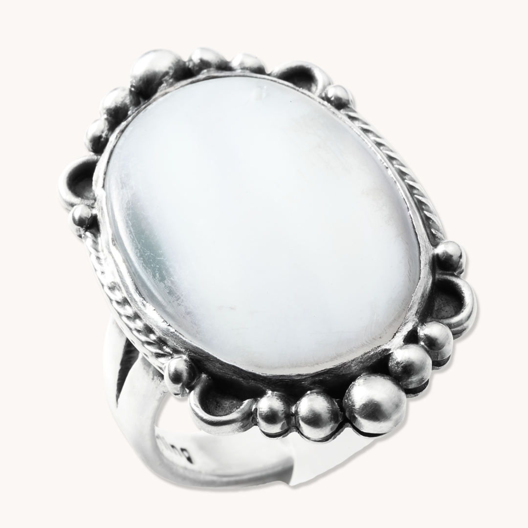 T.Skies Mother of Pearl Ring featuring a large oval stone with silver bead accents, crafted in sterling silver.