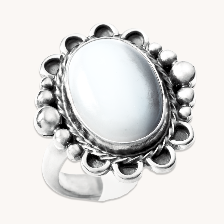 T.Skies delicate Mother of Pearl ring with silver bead accents, featuring an oval stone and intricate silver detailing.