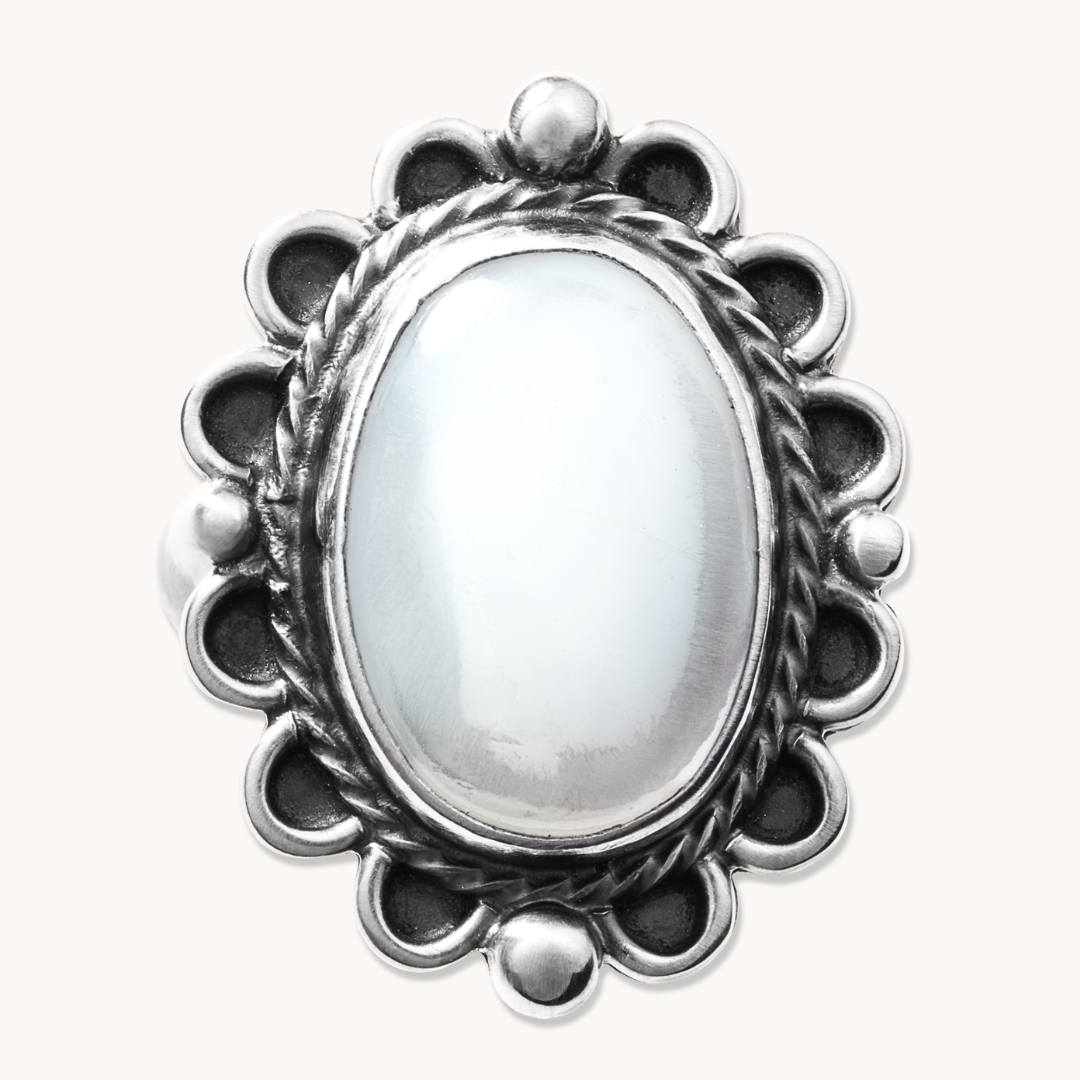 Delicate Mother of Pearl ring with silver bead accents, featuring a polished oval stone and intricate silver detailing.