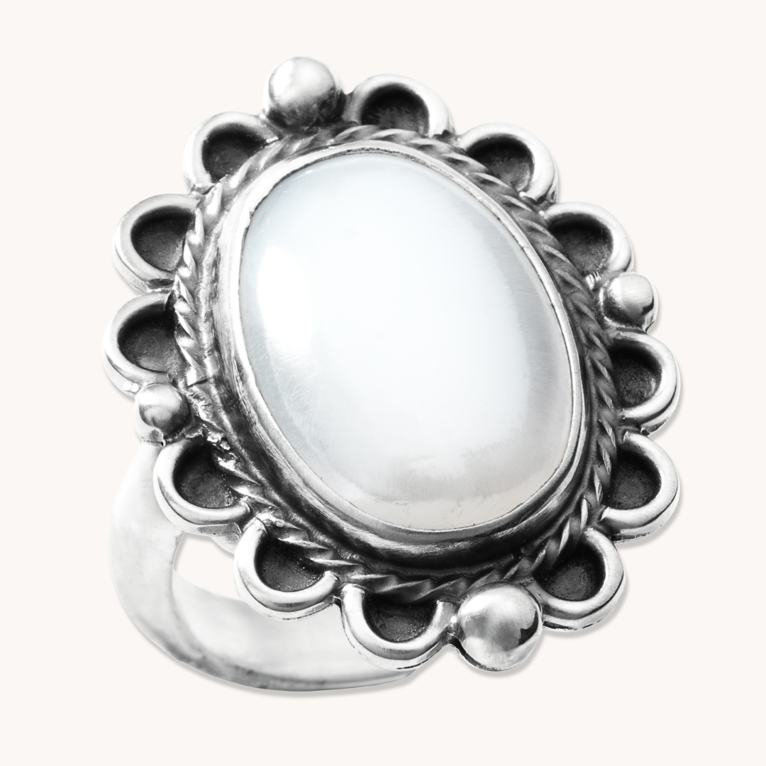 T.Skies delicate Mother of Pearl ring with silver bead accents, featuring an oval stone and intricate silver detailing.