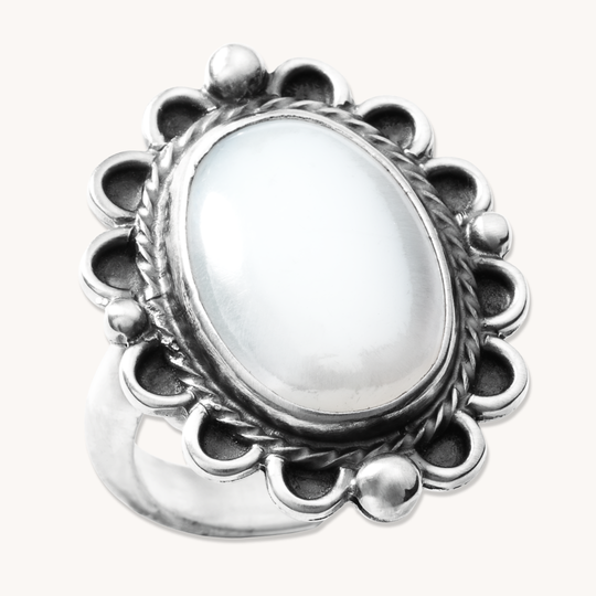 T.Skies delicate Mother of Pearl ring with silver bead accents, featuring an oval stone and intricate silver detailing.