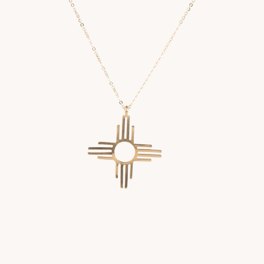 Enchantment: Zia Dangle Jewelry Set, sterling silver necklace featuring a Zia symbol pendant.