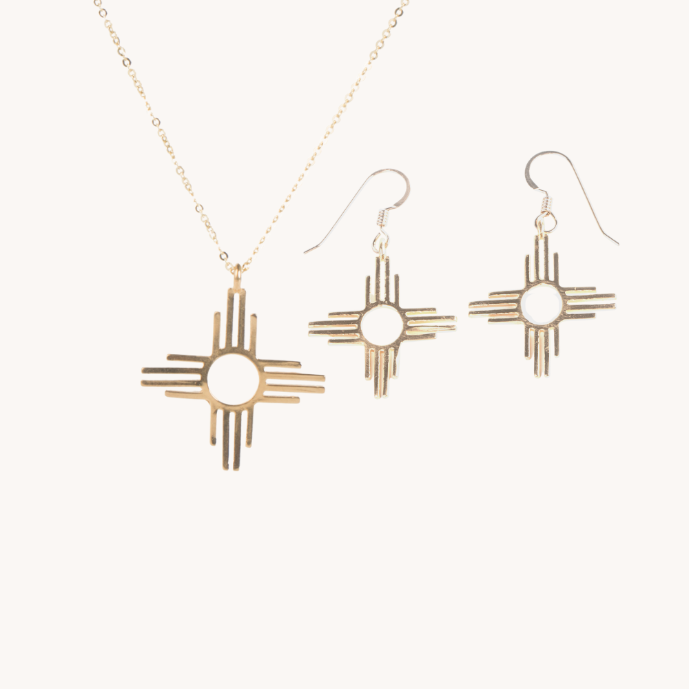 Enchantment: Zia Dangle Jewelry Set, sterling silver necklace and earrings featuring a Zia sun symbol design.