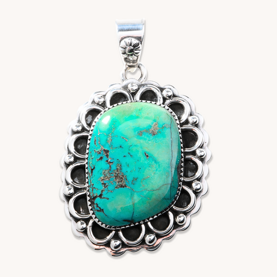 Turquoise Pendant with Silverwork Accents
