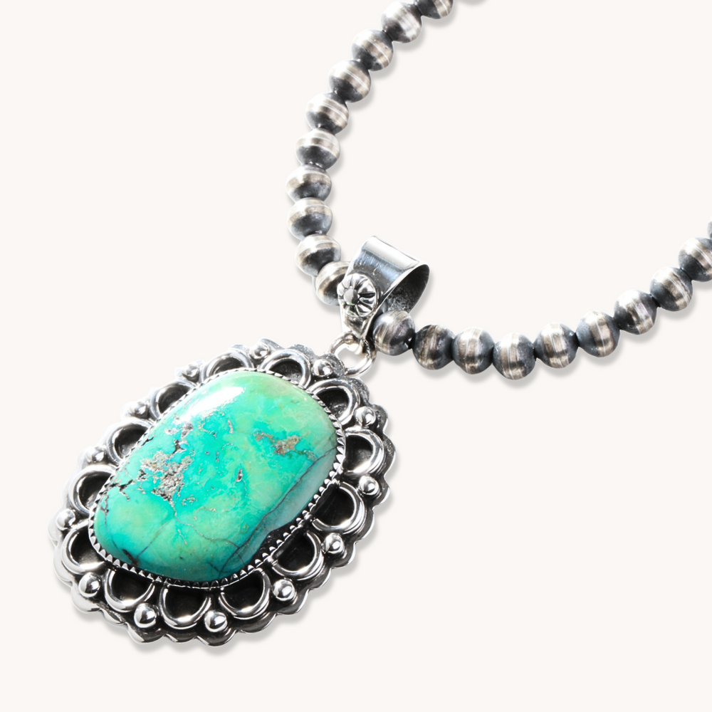 Turquoise Pendant with Silverwork Accents