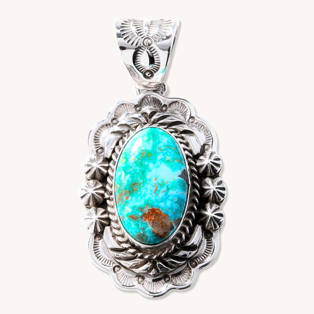 T.Skies Statement Turquoise Pendant in sterling silver featuring an oval turquoise stone with intricate detailing.