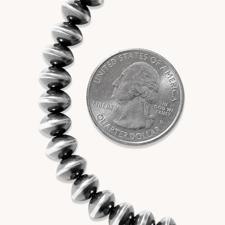 Handcrafted Navajo Pearls Necklace by T.Skies, featuring sterling silver beads with a unique striped design.