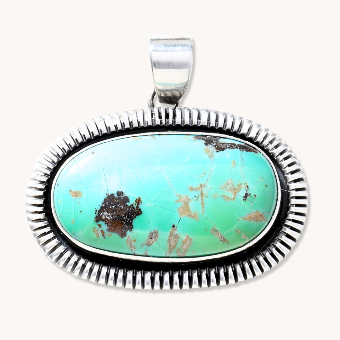 Oblong Turquoise Pendant with Saw-Work Border