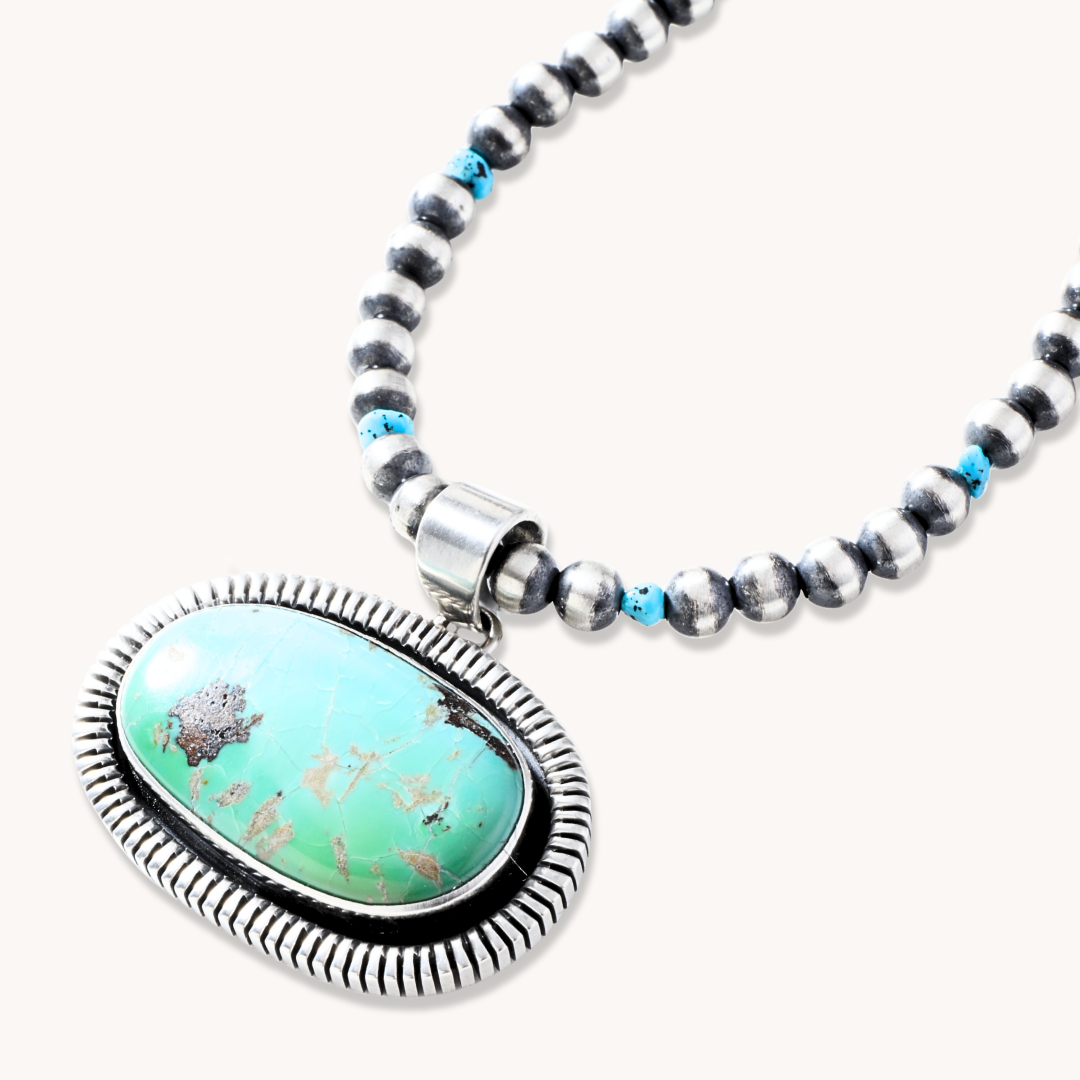 Oblong Turquoise Pendant with Saw-Work Border