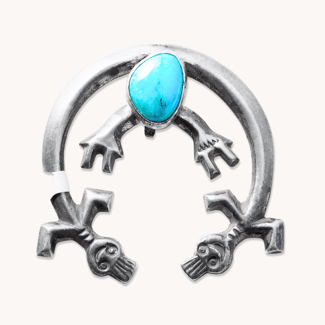 Vintage Turquoise Rainbow Man Pendant in sterling silver featuring a turquoise stone and intricate designs.