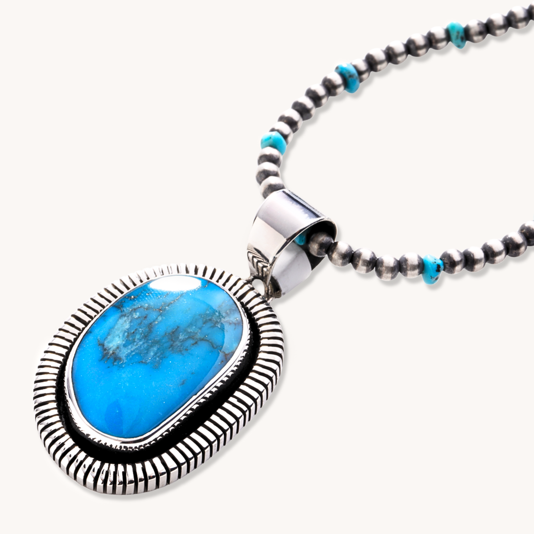 Turquoise Pendants with Saw-Work Border