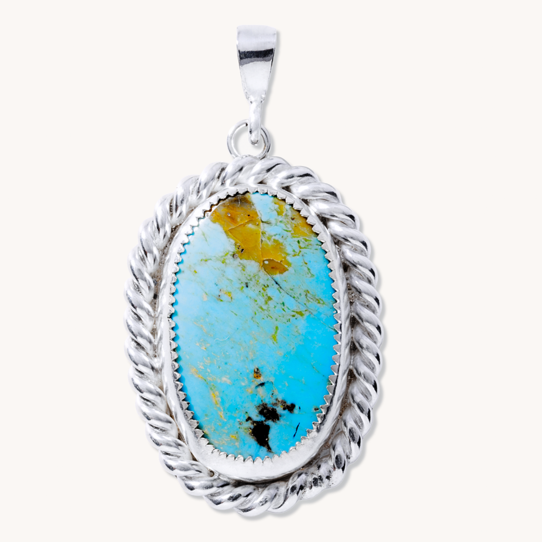 Turquoise Pendant with Twist Wire Border and Feather Cutout