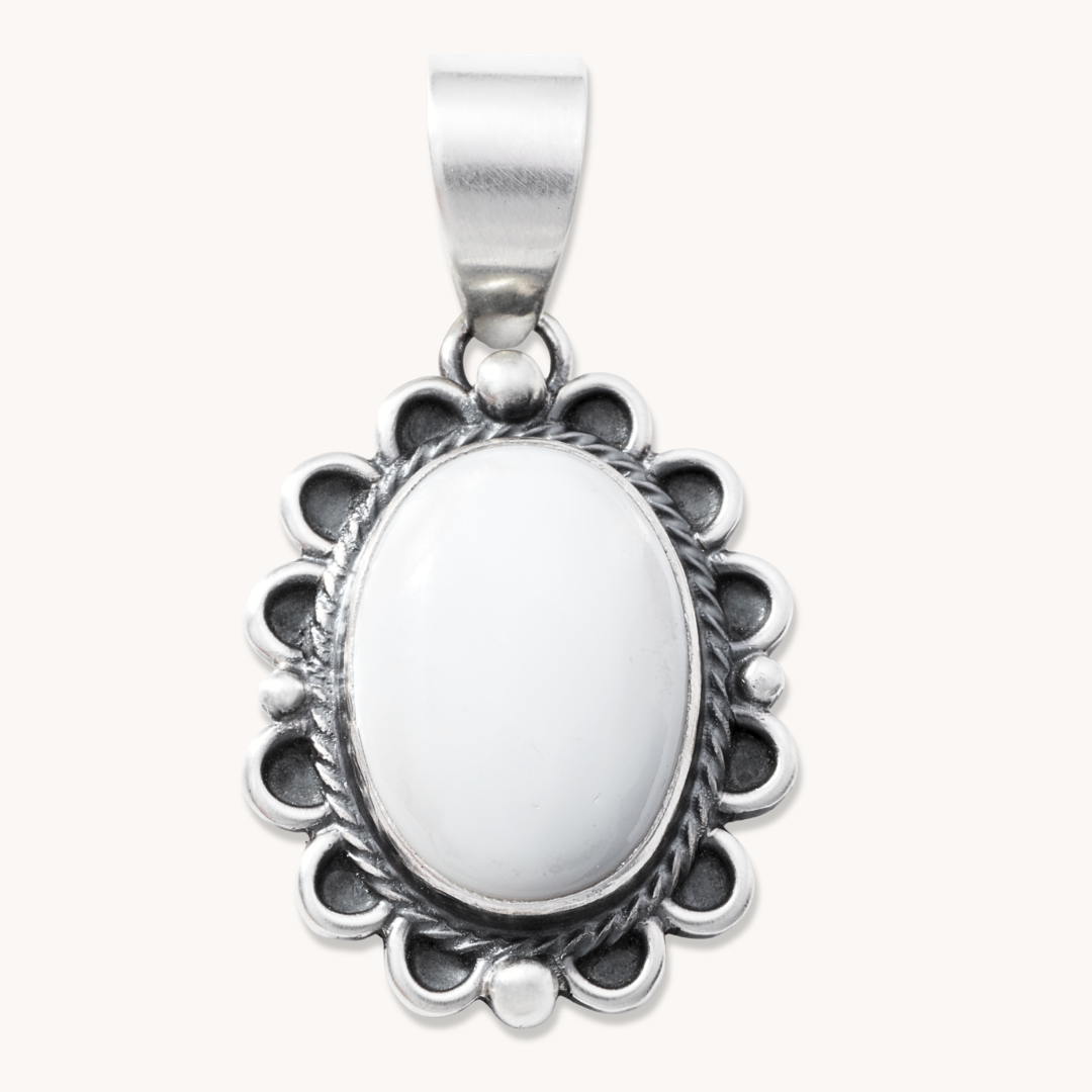 T.Skies Delicate Mother of Pearl Pendant with Silver Button Accents, featuring an oval white stone in a detailed silver setting.