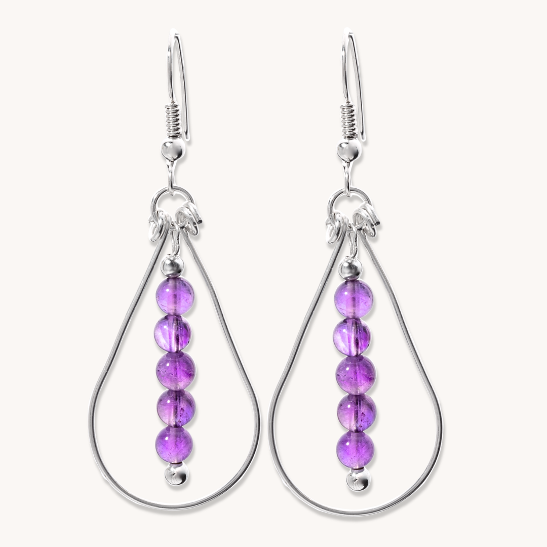 Bead Maiden: Wrapped Intention Earrings in sterling silver featuring five purple beads in a teardrop design.