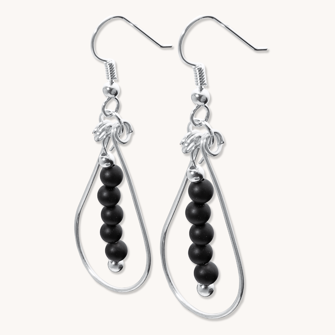 Bead Maiden: Wrapped Intention Earrings in sterling silver featuring a design with black beads.