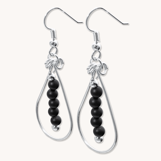 Bead Maiden: Wrapped Intention Earrings in sterling silver featuring a design with black beads.
