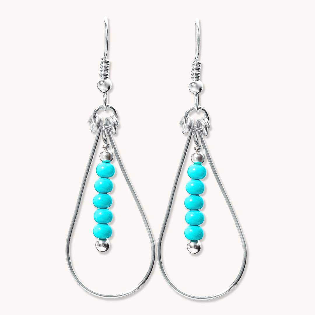 Bead Maiden: Wrapped Intention Earrings in sterling silver featuring turquoise beads and silver accents.
