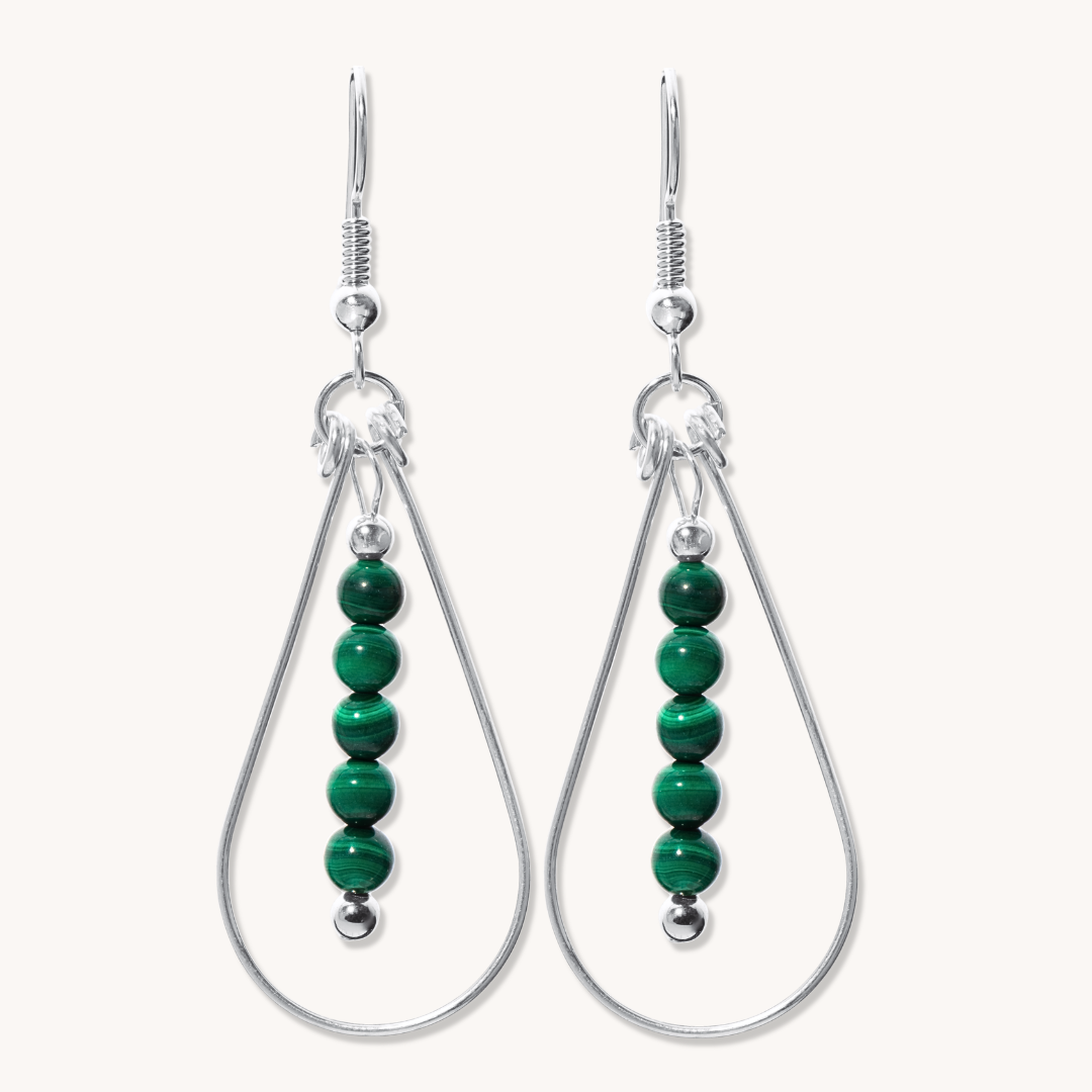 Bead Maiden: Wrapped Intention Earrings made of sterling silver with green malachite beads, featuring a teardrop design.