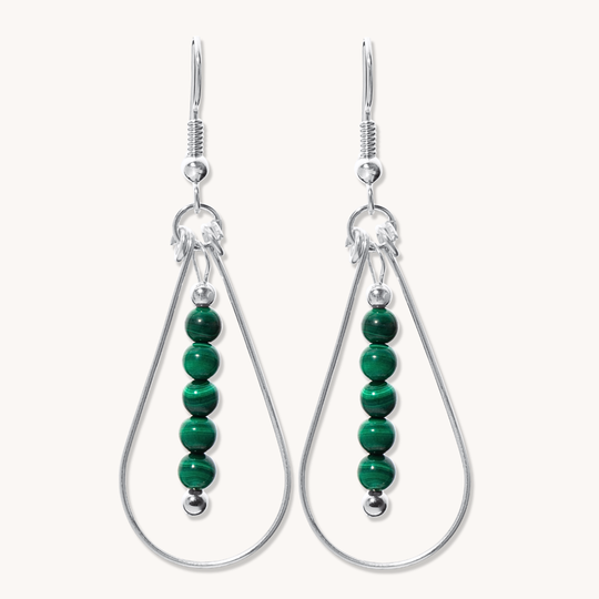 Bead Maiden: Wrapped Intention Earrings made of sterling silver with green malachite beads, featuring a teardrop design.