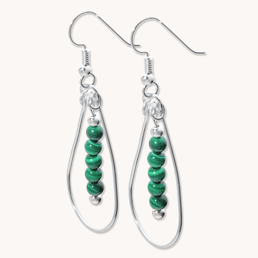 Bead Maiden: Wrapped Intention Earrings made of sterling silver with green malachite beads, featuring a teardrop design.