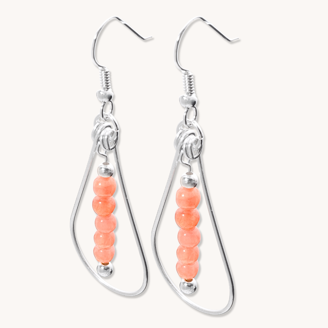 Bead Maiden: Wrapped Intention Earrings, sterling silver with peach beads, showcasing a unique, elegant design.
