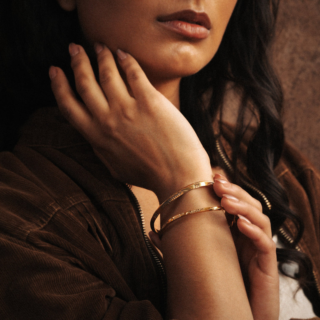 Stamp Dancer: Sage Sisters Bracelet Set in sterling silver worn on a woman's wrist, showcasing elegant design.