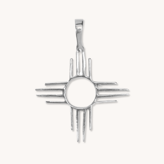 Enchantment: Zia Pendant crafted from sterling silver, featuring a circular center and radiating lines, inspired by Native American design.