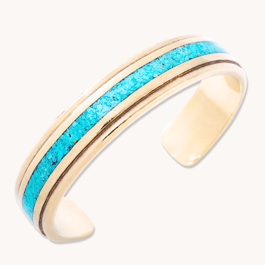 Radiante: Turquoise Vista Bracelet, sterling silver with turquoise inlay and gold accents, elegant cuff design.