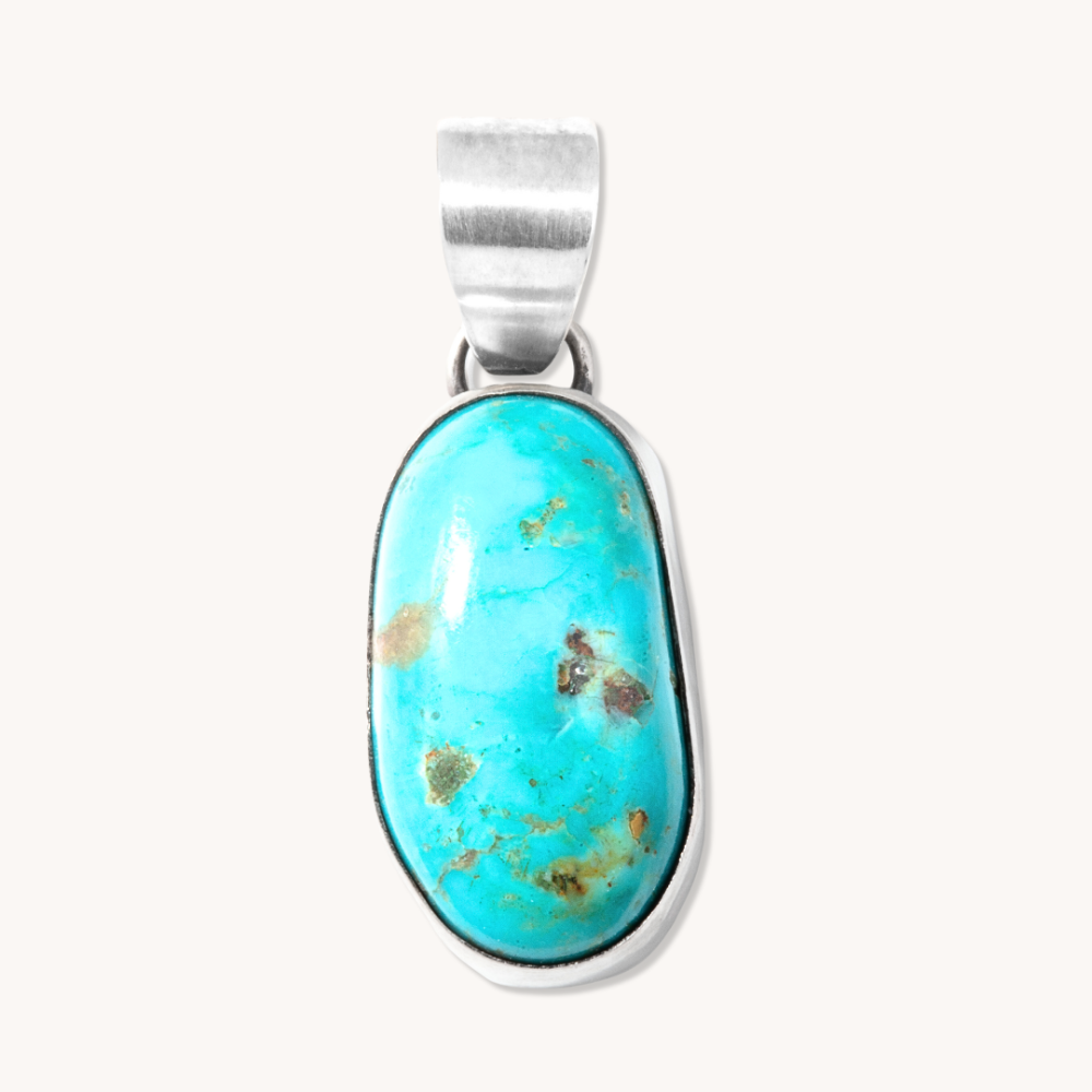Radiante: Mystery Turquoise Pendant made of sterling silver featuring a vibrant turquoise stone with natural variations.