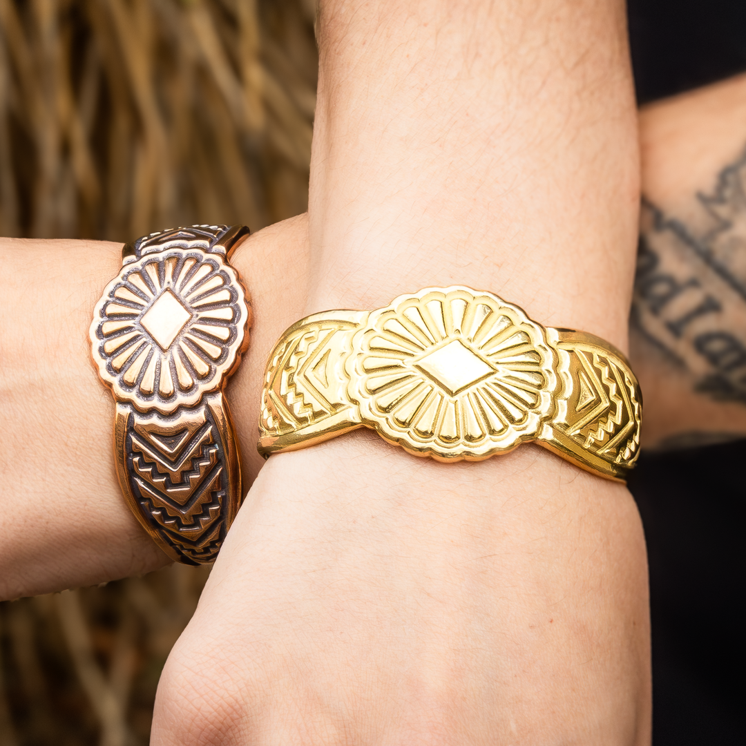 SkyWeaver: Saltillo Cuff Bracelet, sterling silver with intricate designs, worn on two wrists.