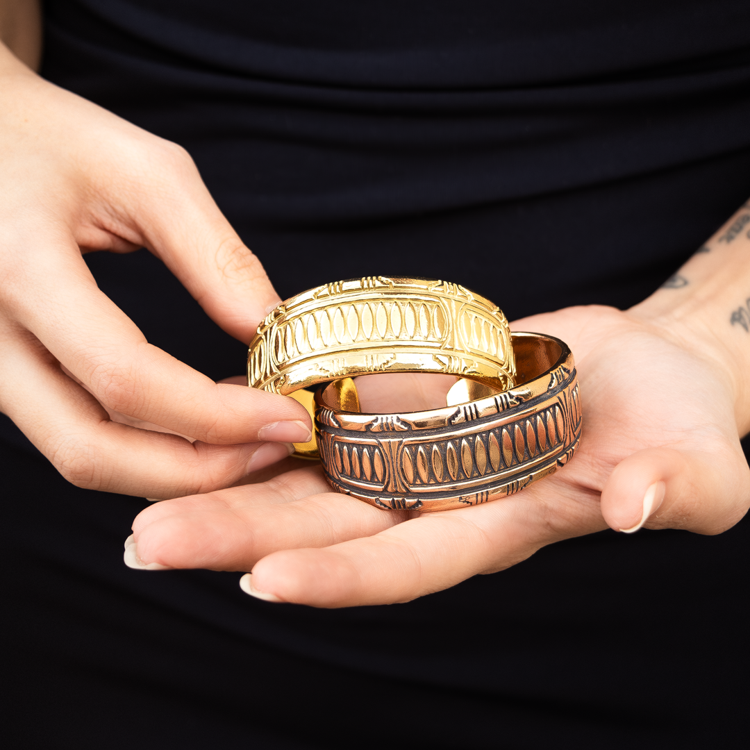 SkyWeaver: Terraced Cuff Bracelet in sterling silver, featuring intricate patterns, held in a person's hand.