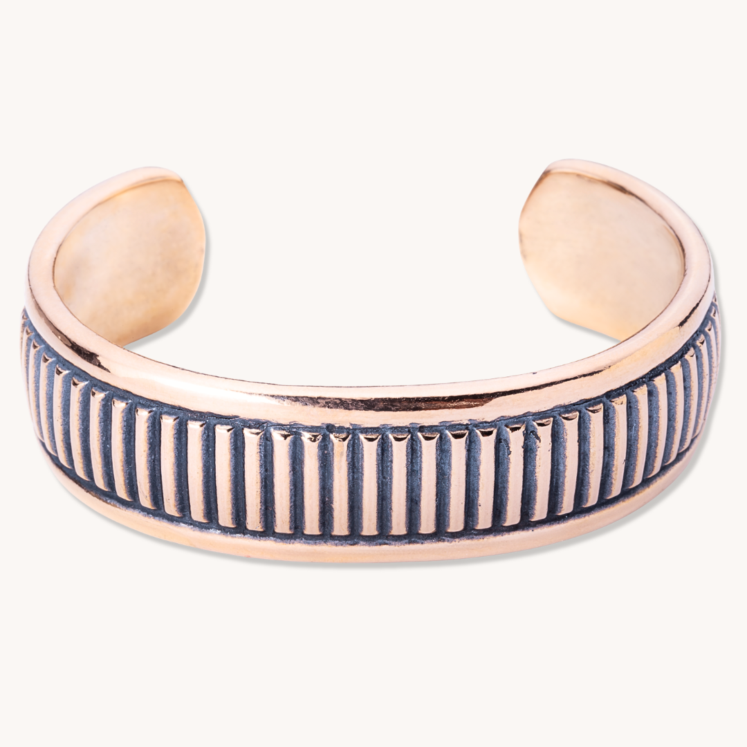 SkyWeaver: Weft Weave Cuff Bracelet made of sterling silver, featuring a textured design with vertical grooves.